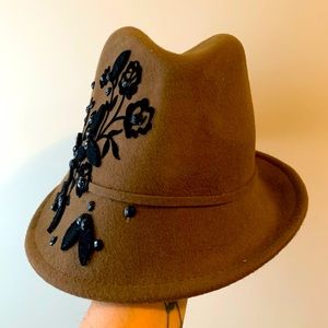 Brown slanted fedora hat with black floral design